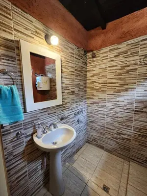 a bathroom with a sink and a mirror at La Vivi in Villa Larca