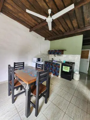 a dining room with a table and a ceiling fan at La Vivi in Villa Larca