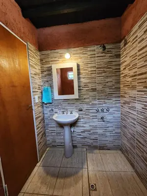 a bathroom with a sink and a shower at La Vivi in Villa Larca