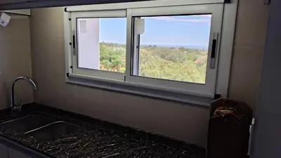 a kitchen with a sink and a window at Bienamada in Merlo