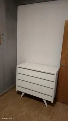 a white dresser sitting in a room at Lo de Andrés y Marina in Arroyo de Los Patos
