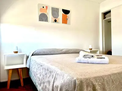 a bedroom with a bed with a tv on a table at DEPARTAMENTO CENTRAL in Cordoba
