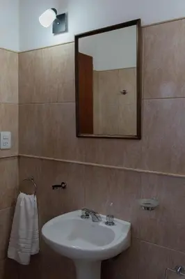 a bathroom with a sink and a mirror at Punto Golondrina in Alta Gracia
