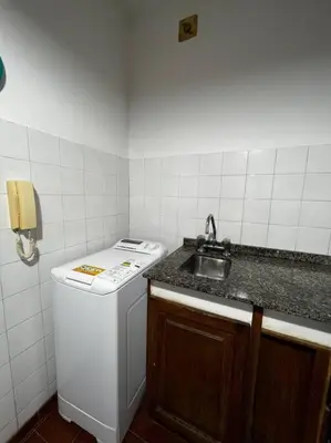 a small kitchen with a sink and a stove at Departamento del Río - Late CheckOut in Cordoba