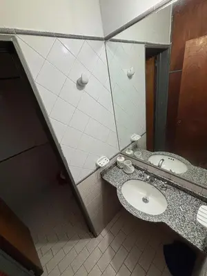a bathroom with a sink and a mirror at Departamento del Río - Late CheckOut in Cordoba
