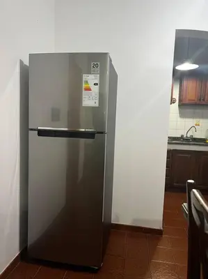 a stainless steel refrigerator in a kitchen at Departamento del Río - Late CheckOut in Cordoba