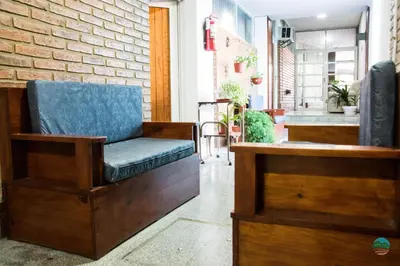 a chair sitting in front of a building at El Quincho in Santa Rosa de Calamuchita