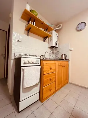 a kitchen with a white stove and a white refrigerator at Departamento moderno Zona centro in Cordoba