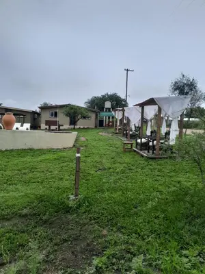 a yard with a group of tents in the grass at Colinas del Mirador in Villa Carlos Paz