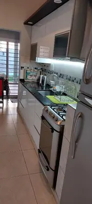 a kitchen with a stove and a counter top at Casa de Descanso Valle Escondido in Cordoba