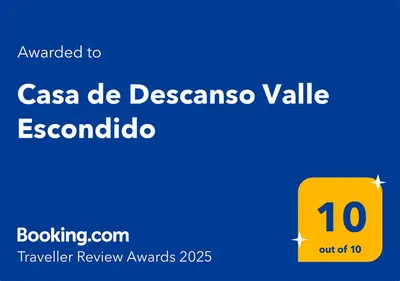 a yellow square with the words casa de desensasinas valley on top at Casa de Descanso Valle Escondido in Cordoba