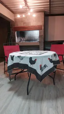a table with chickens on it in a room at Casa de Descanso Valle Escondido in Cordoba