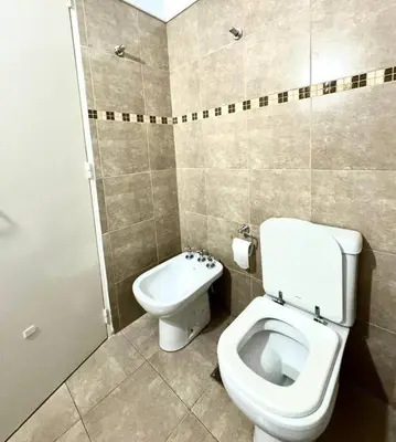 a bathroom with a toilet and a bidet at Departamento Altas in Cordoba