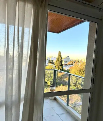 a room with a window with a view at Departamento Altas in Cordoba