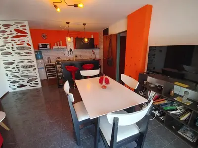 a dining room with a white table and chairs at Departamento Urquiza 269 in Cordoba
