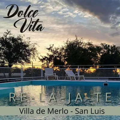 a picture of a swimming pool with chairs and the words dale ville ne at Dolce Vita in Merlo