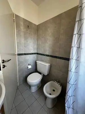 a small bathroom with a toilet and a sink at El Abrojal 3 - Dpto 1 dormitorio a 3 cuadras Patio Olmos in Cordoba