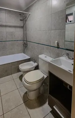 a bathroom with a toilet and a sink at Loft General Paz in Cordoba
