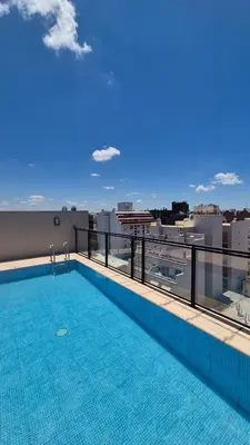 a swimming pool on the roof of a building at Loft General Paz in Cordoba