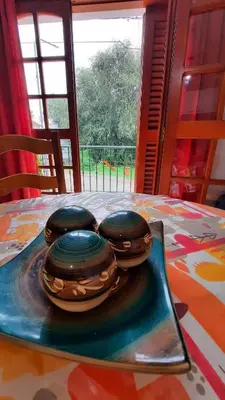 four donuts sitting on a plate on a table at Ofelia, departamento en Alta Gracia. in Alta Gracia