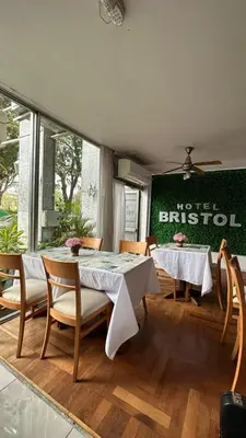 a dining room with a table and chairs at Hotel Bristol in Cordoba