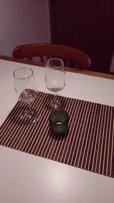 two wine glasses and a ashtray on a table at Estancia Nueva Córdoba II in Cordoba