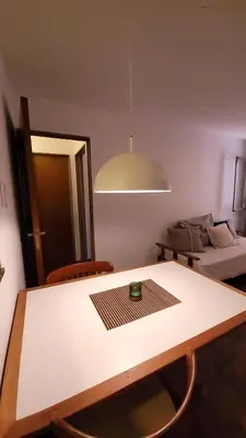 a room with a table and chairs and a bed at Estancia Nueva Córdoba II in Cordoba