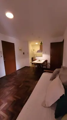 a living room with a couch and a table at Estancia Nueva Córdoba II in Cordoba