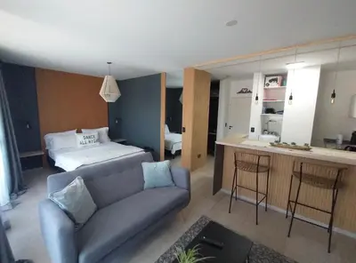 a living room with a couch and a bed at Depto VCP in Villa Carlos Paz