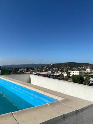 a swimming pool with a view of a city at Depto VCP in Villa Carlos Paz