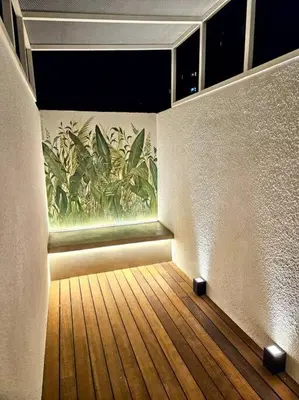 a room with a painting of plants on the wall at Departamento cálido y tranquilo SS2 in Cordoba