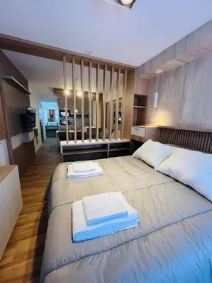 a bedroom with two beds with towels on them at Departamento en hermosa zona de Nueva Córdoba. SS3 in Cordoba