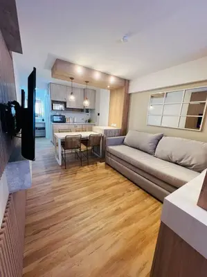 a living room with a couch and a table at Departamento en hermosa zona de Nueva Córdoba. SS3 in Cordoba