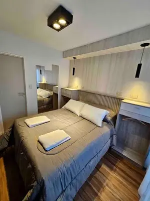 a bedroom with a bed with two towels on it at Estudio - apartamento renovado y confortable SS4 in Cordoba