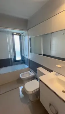 a bathroom with a toilet and a sink and a tub at Dpto Obispo Trejo - Nueva Cba - Alquiler mínimo por 3 meses in Cordoba