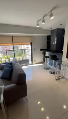 a living room with a couch and a table at Dpto Obispo Trejo - Nueva Cba - Alquiler mínimo por 3 meses in Cordoba