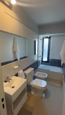 a bathroom with a toilet and a sink and a tub at Dpto Obispo Trejo - Nueva Cba - Alquiler mínimo por 3 meses in Cordoba