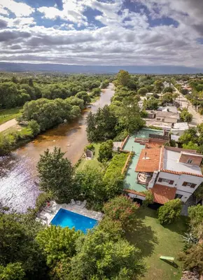 an aerial view of a river with houses at Cabañas el Bierzo in Villa Cura Brochero