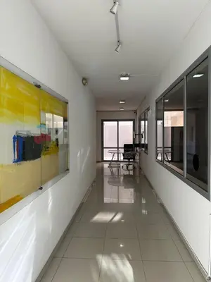 a hallway with paintings on the walls of a building at Depto 
