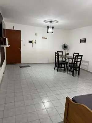 a dining room with chairs and a table in a room at Alejandro Carbo in Cordoba