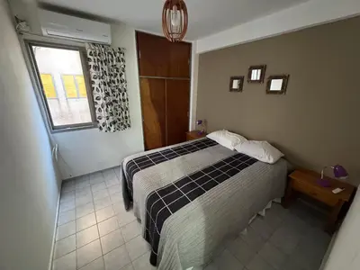 a hotel room with a bed and a window at Alejandro Carbo in Cordoba