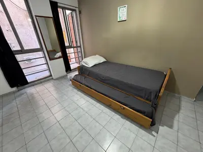 a small bed in a room with a window at Alejandro Carbo in Cordoba