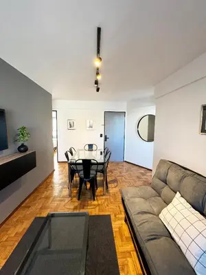 a living room with a couch and a table at Depto. 2 Dorm. premium vista Buen Pastor Av Yrigoyen in Cordoba