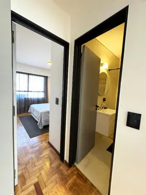 a room with a door leading to a bedroom at Depto. 2 Dorm. premium vista Buen Pastor Av Yrigoyen in Cordoba