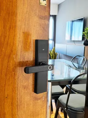 a door with a speaker on it next to a table at Depto. 2 Dorm. premium vista Buen Pastor Av Yrigoyen in Cordoba