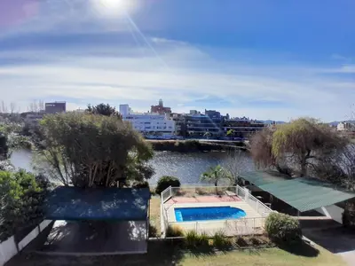 a swimming pool in the middle of a river at HOTEL CRISTAL in Villa Carlos Paz