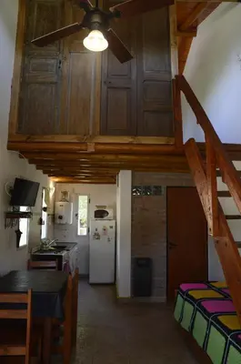 a kitchen with a vaulted ceiling with a ceiling fan at Rancho Pampa in Villa Ciudad Parque