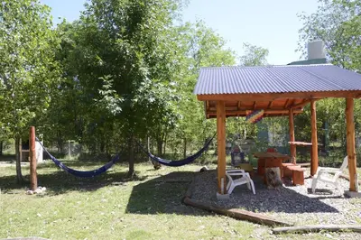 a playground with a hammock and a gazebo at Rancho Pampa in Villa Ciudad Parque