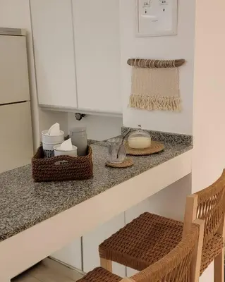 a kitchen counter with two chairs and a counter top at La mejor ubicación para alojarte! in Cordoba
