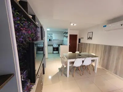 a kitchen and dining room with a table and chairs at Torre Opera Depto 3º B in Villa Carlos Paz